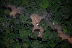 108756945-files-aerial-view-showing-a-bulldozer-removing-wood-from-a-deforested-area-in-the-amaz