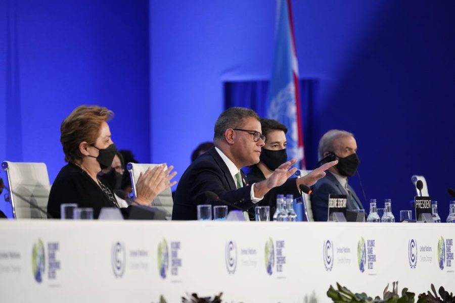 Britain's Alok Sharma President of the COP26, second left, gestures as delegates applaud, flanked by Patricia Espinosa, left, UNFCCC Executive-Secretary, during the closing plenary session at the COP26 U.N. Climate Summit, in Glasgow, Scotland, Saturday, Nov. 13, 2021. Almost 200 nations were poised Saturday to adopt a compromise on how to curb climate change and to keep a key global warming target alive after 15 days of contentious climate talks. (AP Photo/Alberto Pezzali)